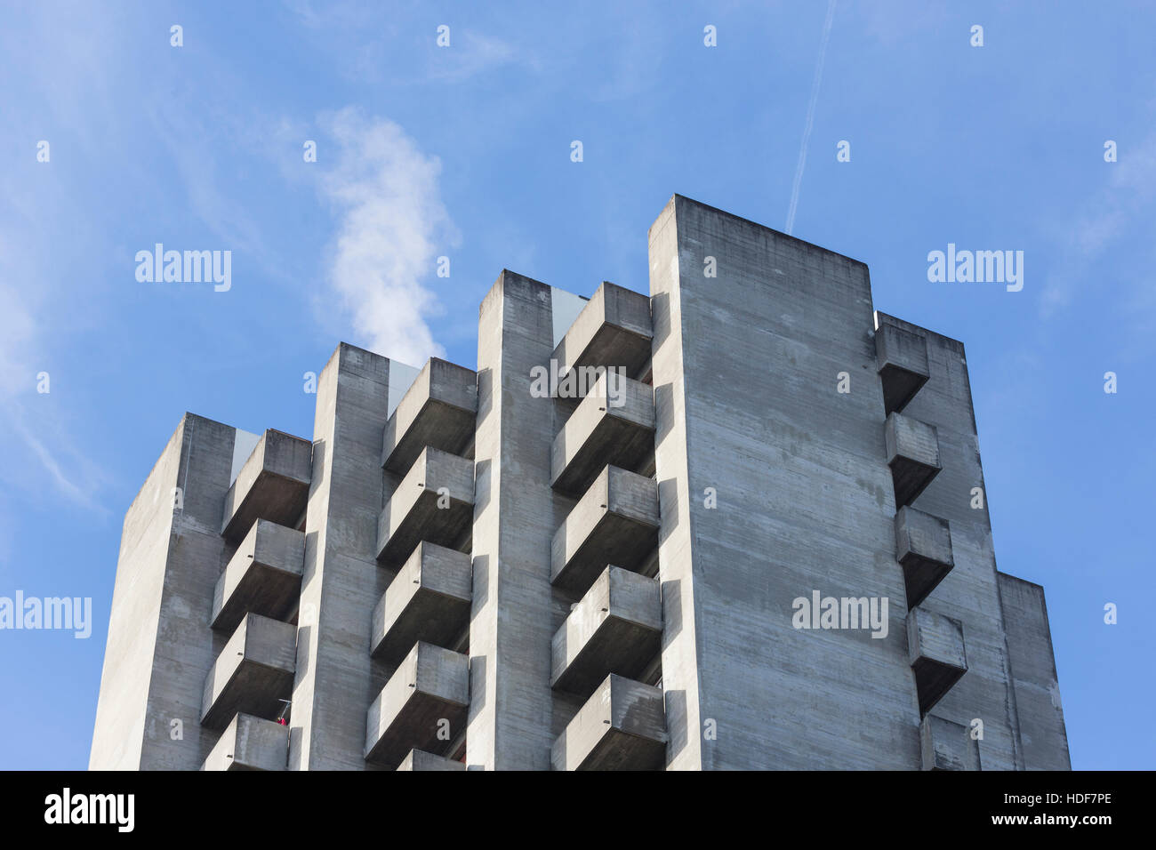 brutalism concrete highrise apartments with balcony on a slope Stock Photo