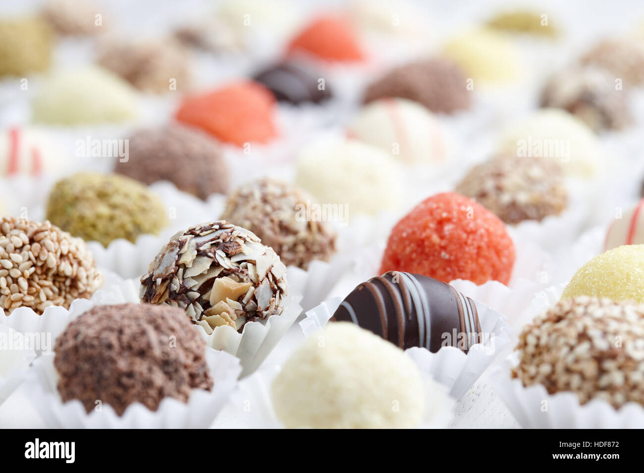 Truffle chocolates in rows Stock Photo