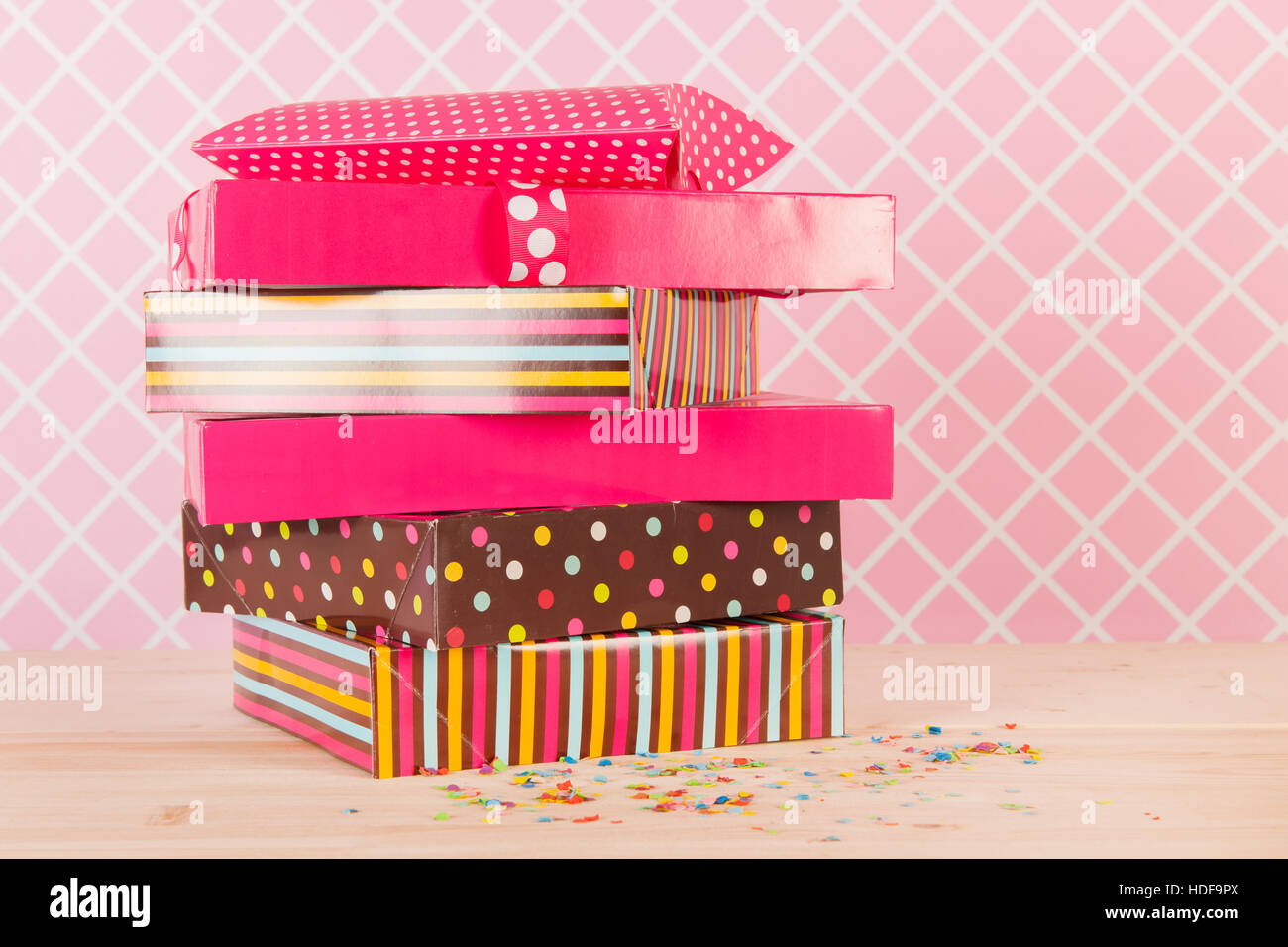 Colorful birthday presets on pink background Stock Photo - Alamy