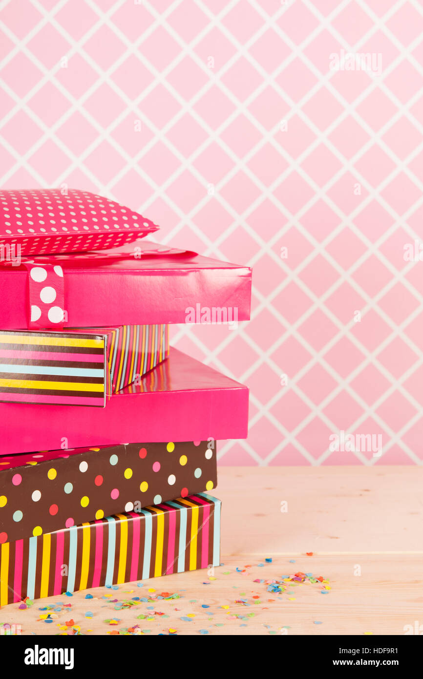 Colorful birthday presets on pink background Stock Photo - Alamy