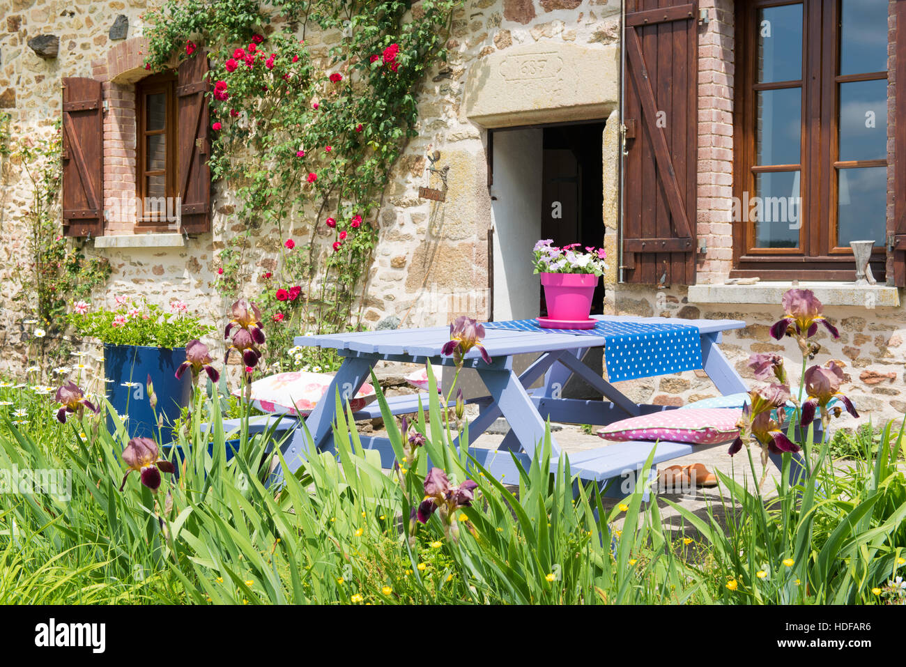Colorful picnic table in the French garden Stock Photo Alamy