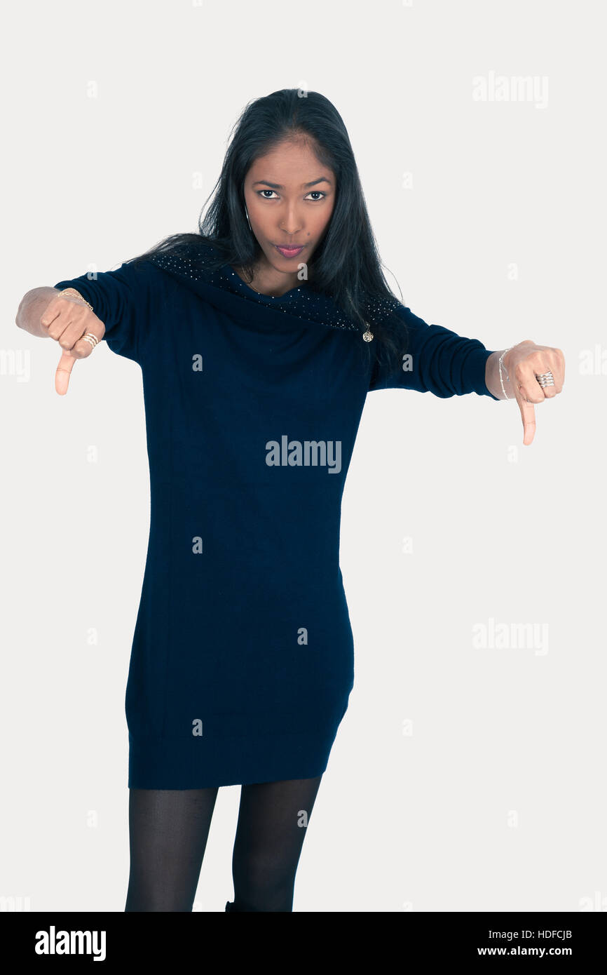 Beautiful woman doing different expressions in different sets of clothes thumbs down Stock