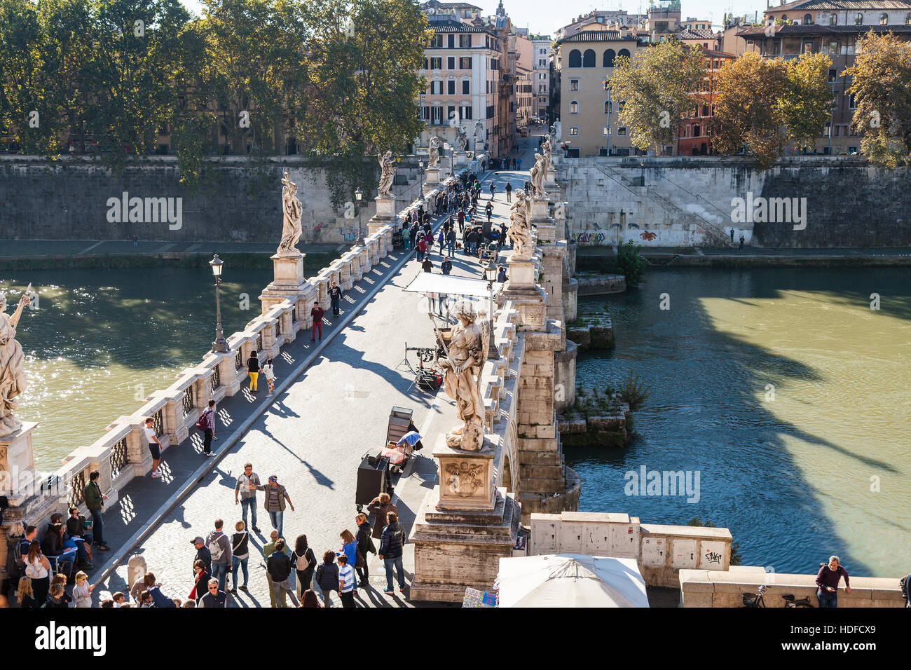 ROME, ITALY - OCTOBER 31, 2016: above view of tourists walk on St Angel Bridge ( Ponte Sant' Angelo) from Castel Sant'Angelo (Castle of Holy Angel, Ma Stock Photo