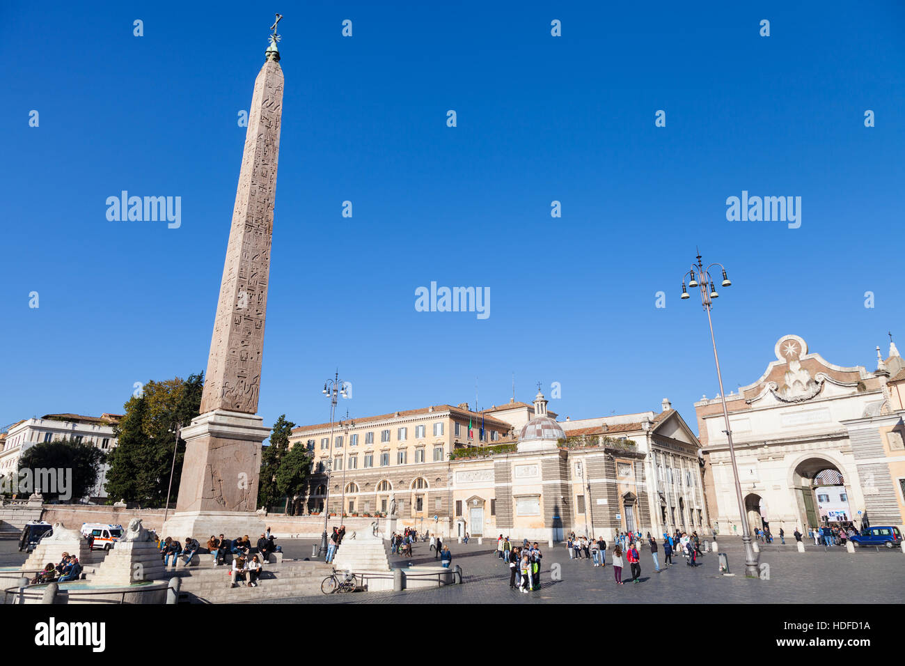 ROME, ITALY - NOVEMBER 1, 2016: people, Egyptian obelisk of Ramesses II, Porta del Popolo (gate in ancient Aurelian Walls) on Piazza del Popolo in Rom Stock Photo