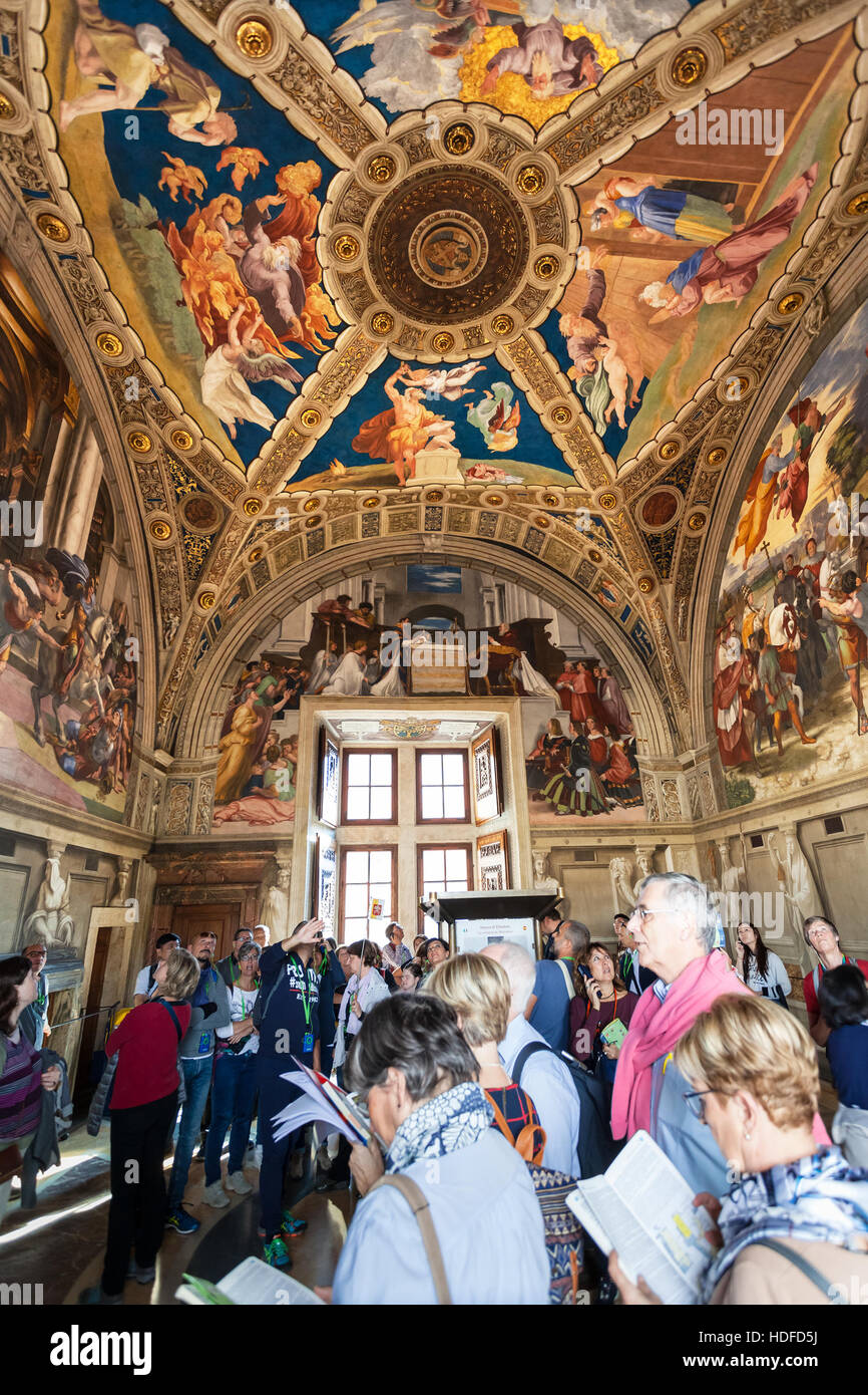 VATICAN, ITALY - NOVEMBER 2, 2016: Visitors in Stanza di Eliodoro (Room of Heliodorus) decorated by Raphael's frescoes in Raphael Rooms (Stanze di Raf Stock Photo