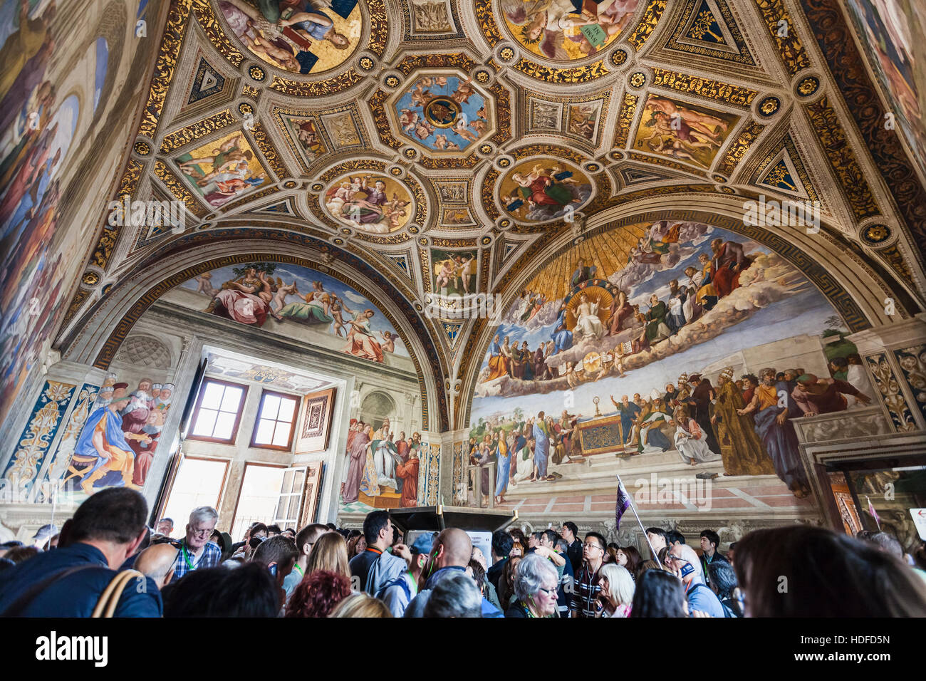 VATICAN, ITALY - NOVEMBER 2, 2016: Visitors in Stanza della segnatura (Room of the Signatura) decorated by Raphael's frescoes in Raphael Rooms (Stanze Stock Photo
