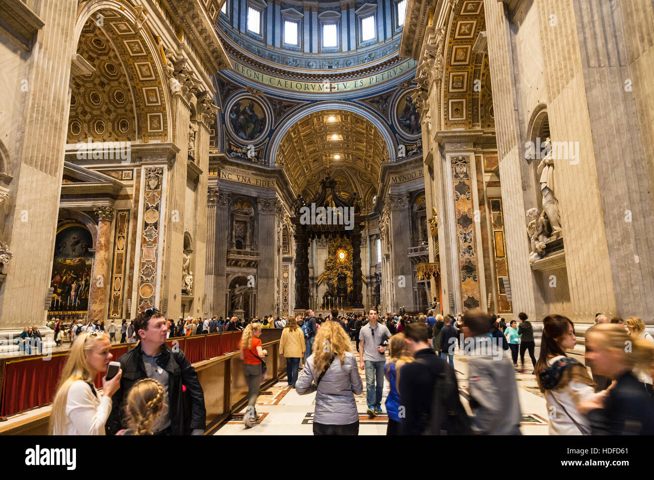VATICAN, ITALY - NOVEMBER 2, 2016: visitors in Papal Basilica of St Peter. Basilica is Catholic Cathedral, the central and most prominent building of Stock Photo