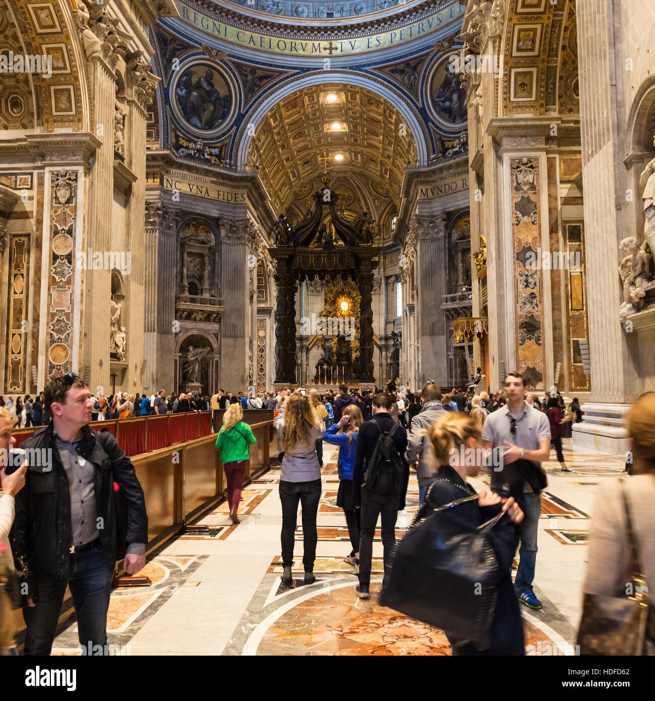 VATICAN, ITALY - NOVEMBER 2, 2016: tourists in Papal Basilica of St Peter. Basilica is Catholic Cathedral, the central and most prominent building of Stock Photo
