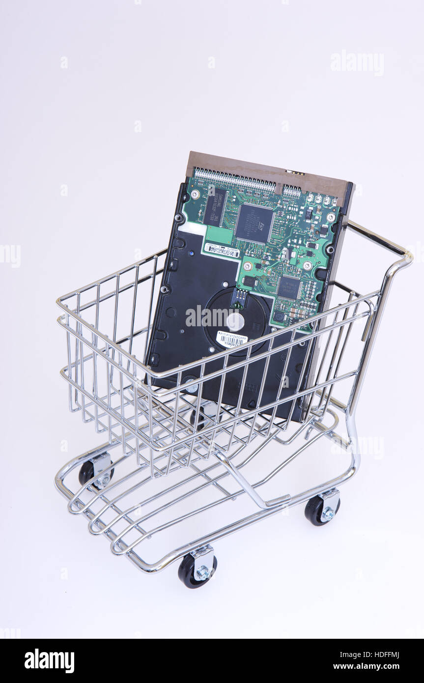 Computer hard disk, electronics in a shopping trolley Stock Photo