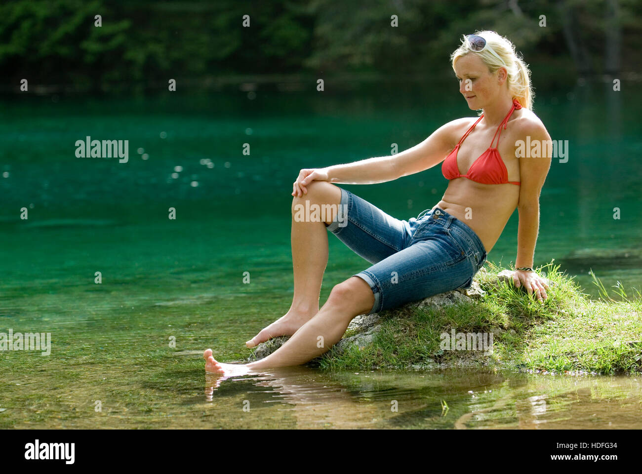 A woman at a lake Stock Photo