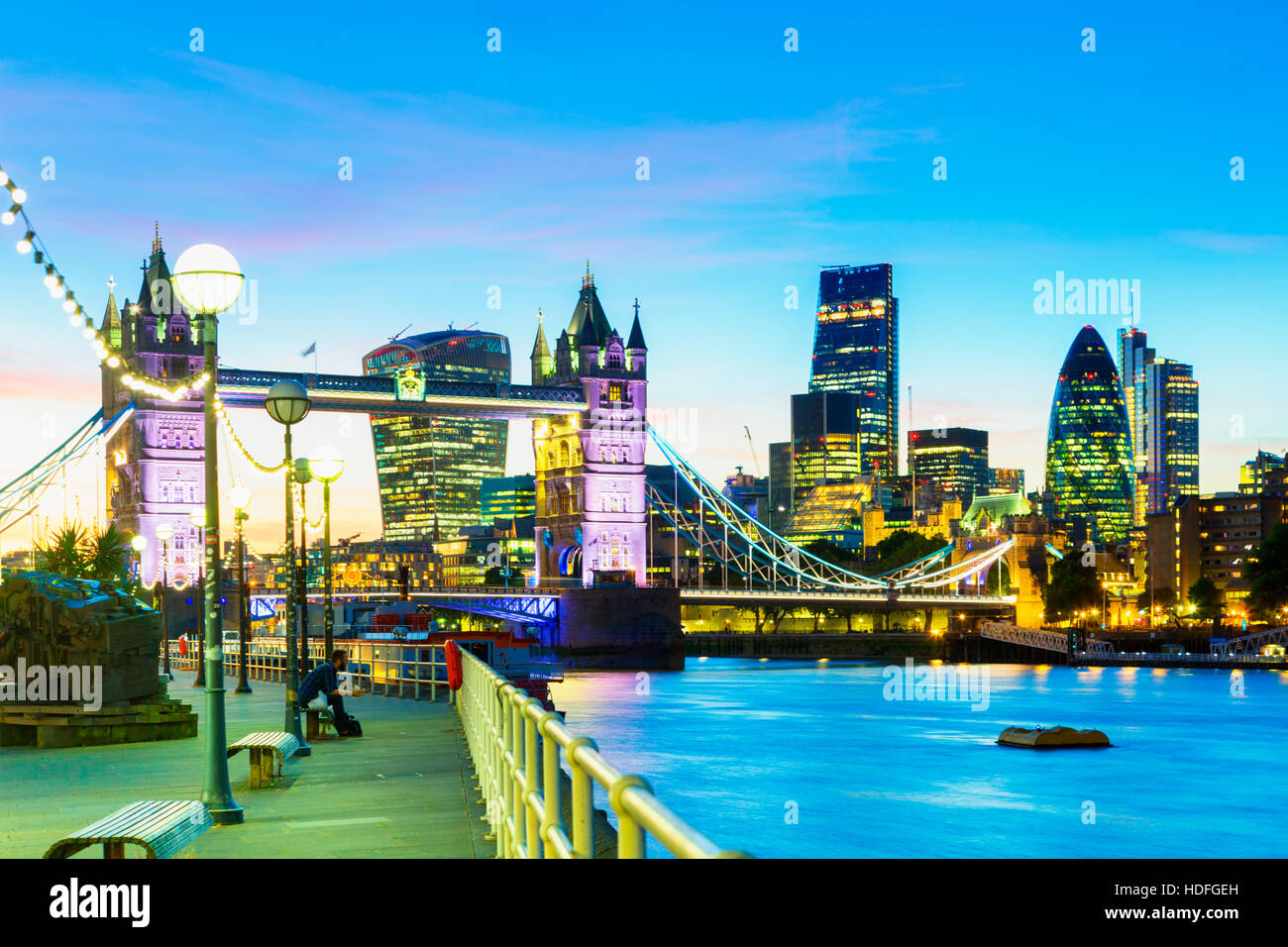 A beautiful dusk-time view of Tower Bridge and the River Thames in London, with financial district in background Stock Photo