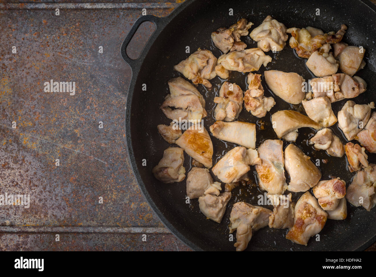 Fried chicken in the pan top view Stock Photo