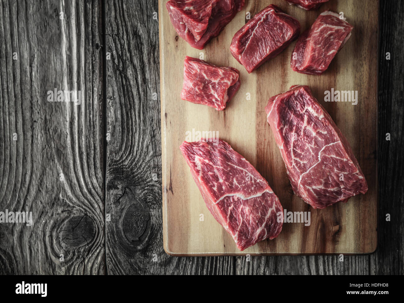 Raw angus beef slices on the wooden board Stock Photo
