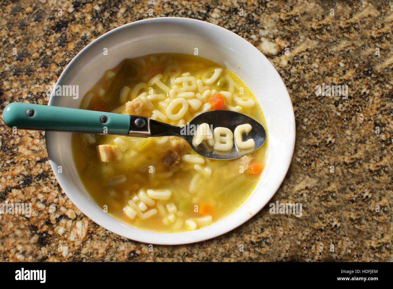 bowl of alphabet soup with the letters abc spelled out in noodles Stock ...