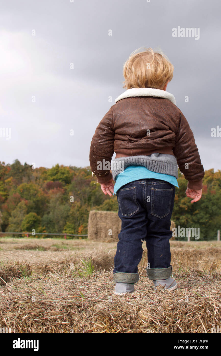 Boy playing outside in fall hi-res stock photography and images - Alamy