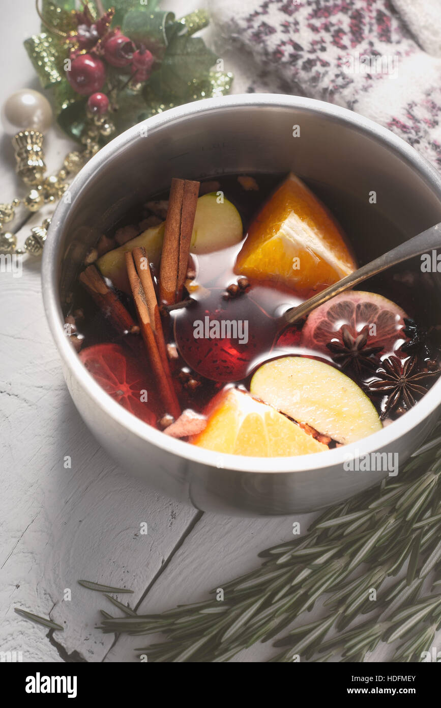Mulled wine with different spices  and fruits in the pot top view Stock Photo