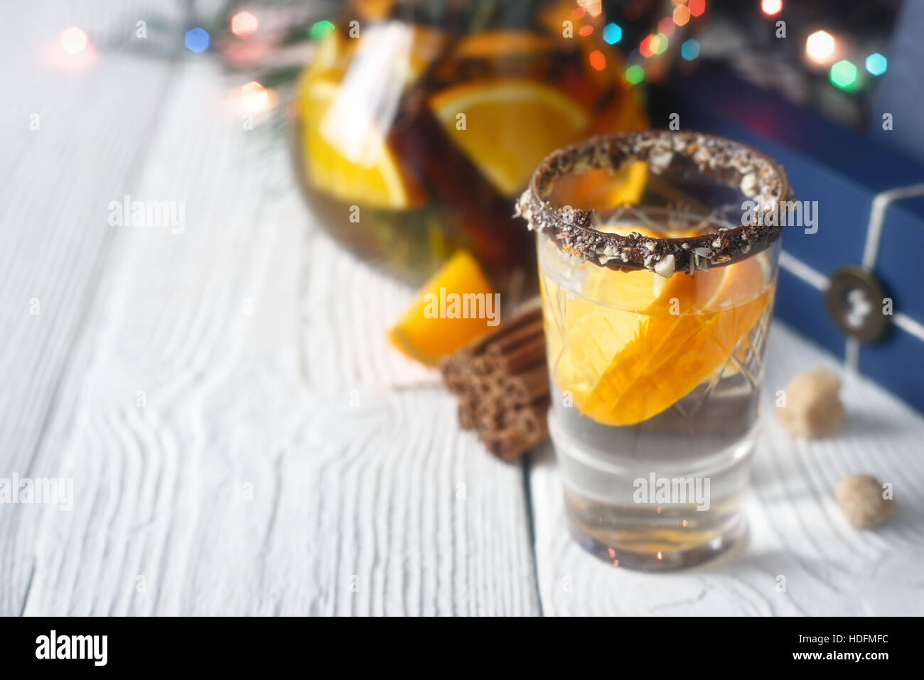 Citrus cocktail in the decorated glass on the white wooden table Stock Photo
