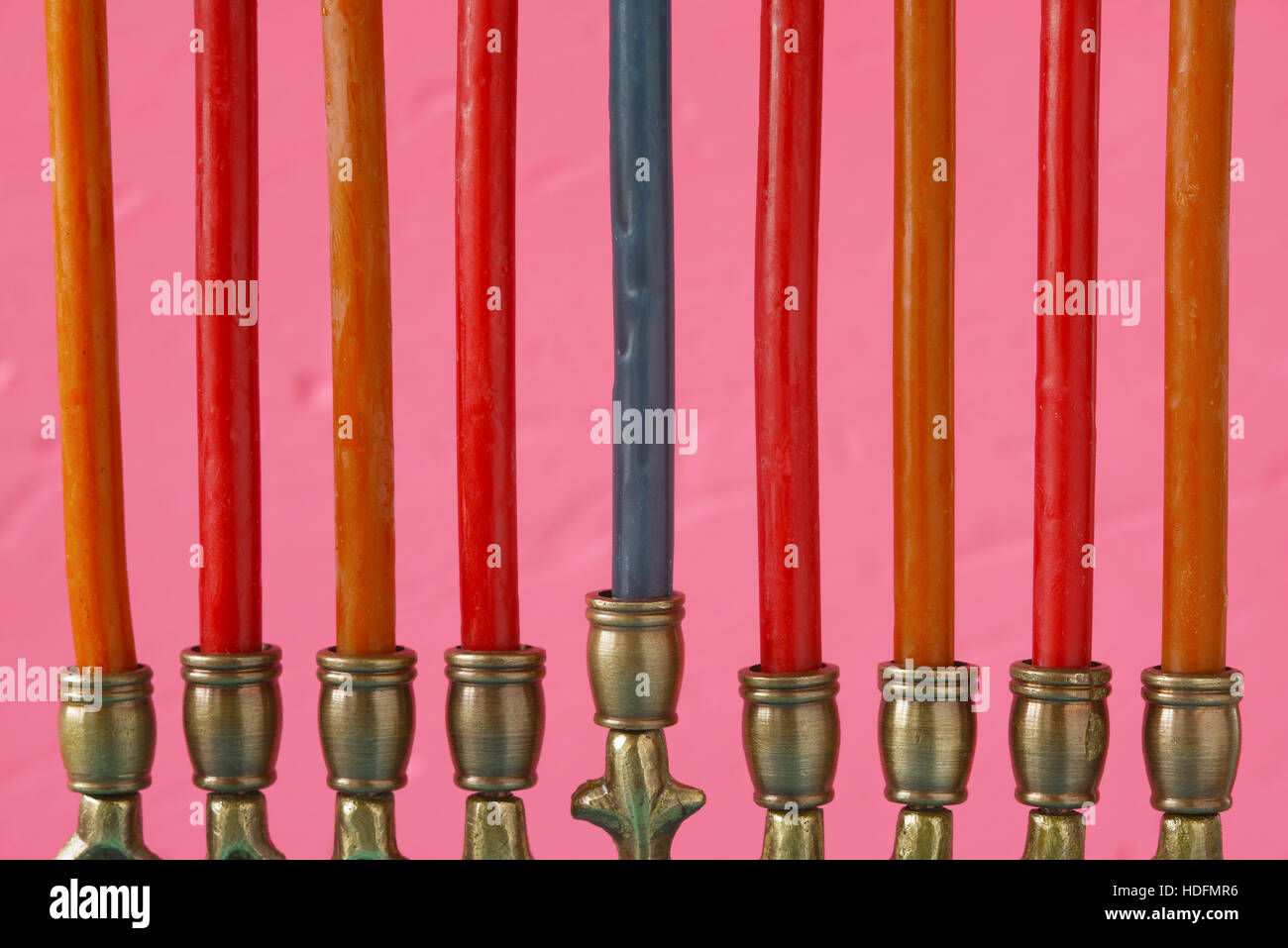 Hanukkah menorah with candles on the pink background Stock Photo
