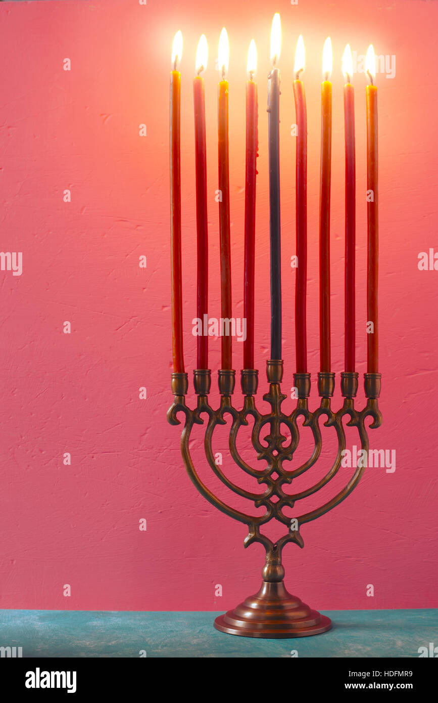 Candles burning on hanukkah menorah hires stock photography and images