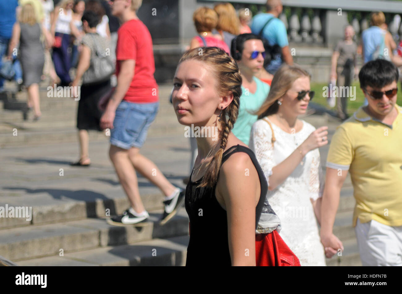 Russian girl looking skeptical to the camera. Gorky Park, Moscow, Russia Stock Photo