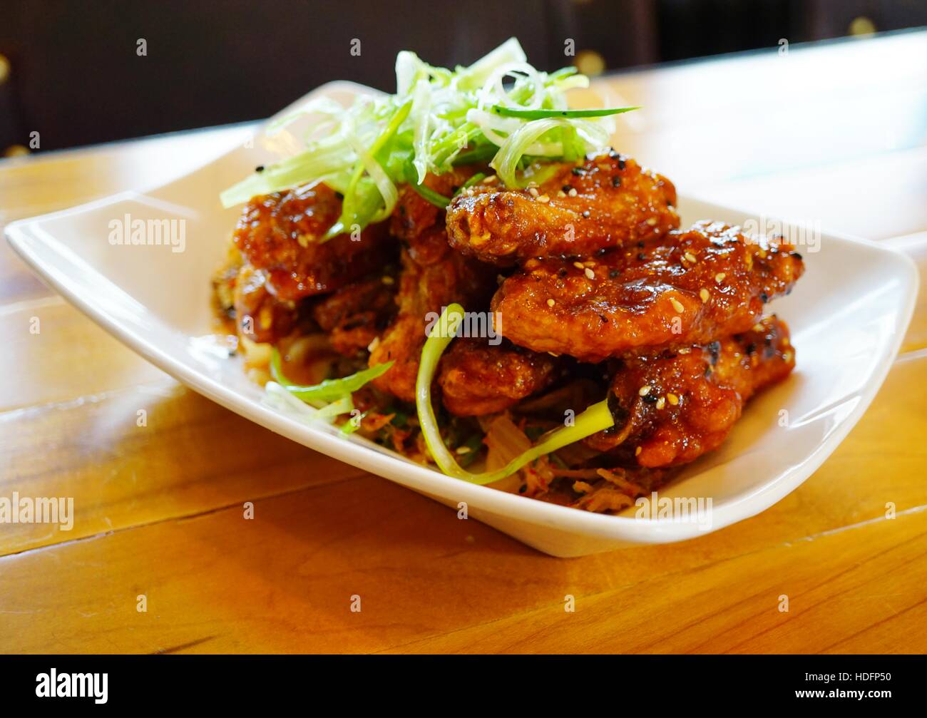 Platter of Korean barbecue chicken wings with scallions Stock Photo Alamy
