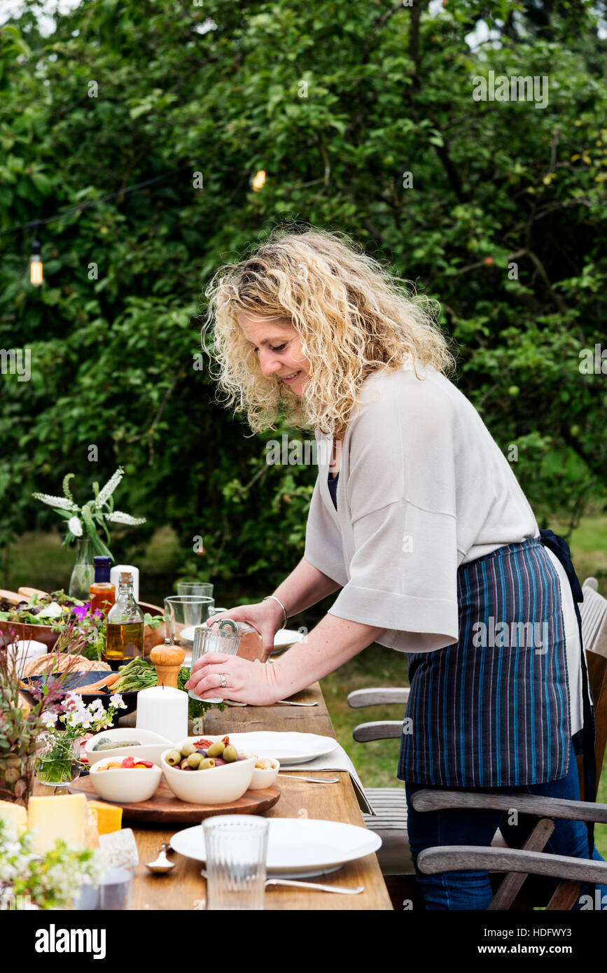 Woman Preparing Table Dinner Concept Stock Photo - Alamy