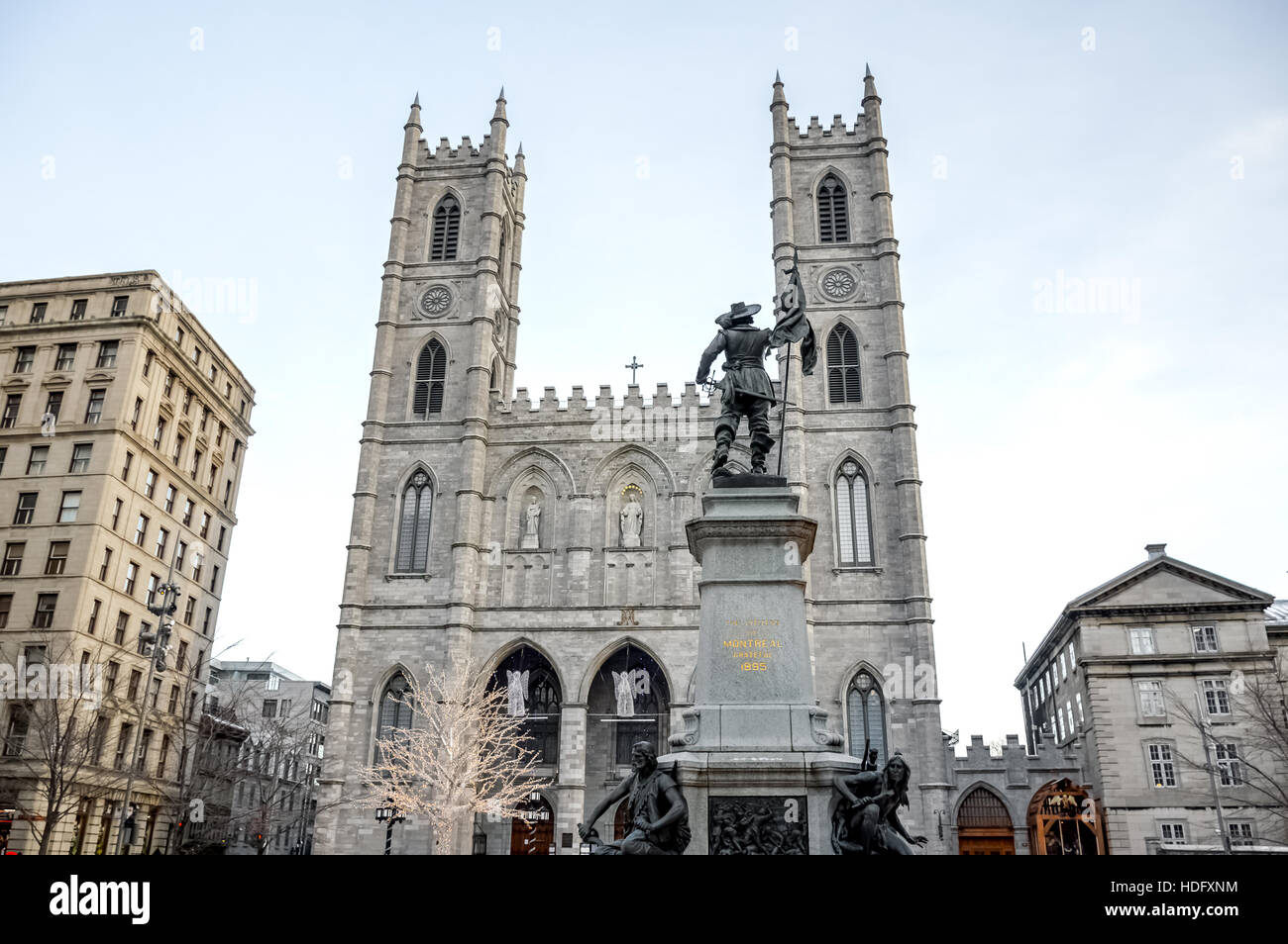 Basilica Notre Dame with statue of Paul de Chomedey de Maisonneuve, founder of Montreal. In Old Town, Montreal, Canada. Stock Photo