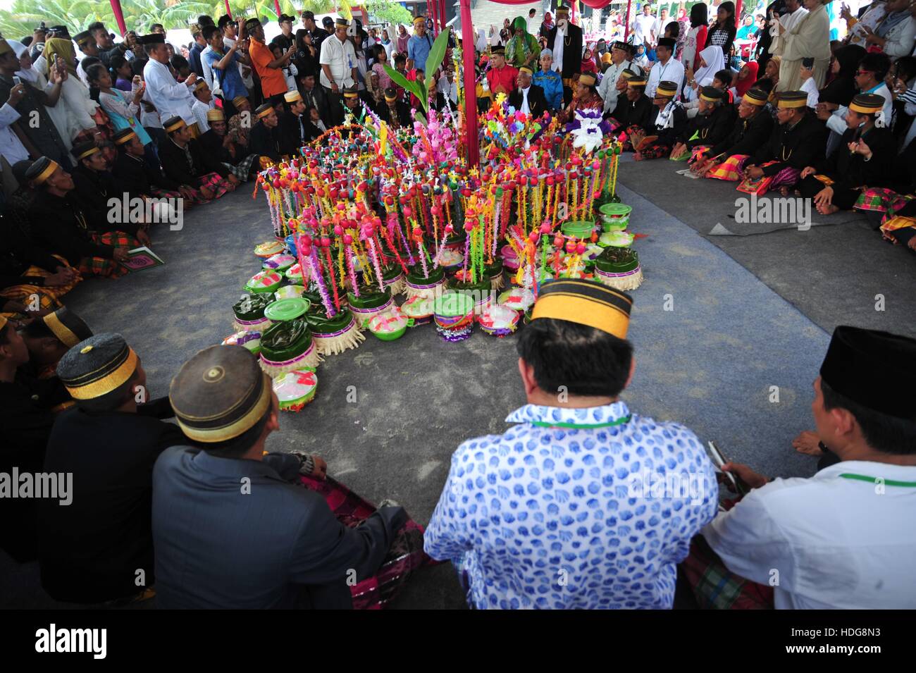 Jakarta, Indonesia. 12th Dec, 2016. Food and decorated eggs are collected during a celebration marking the birthday of the Islamic Prophet Muhammad in Jakarta, Indonesia, Dec. 12, 2016. Credit:  Zulkarnain/Xinhua/Alamy Live News Stock Photo