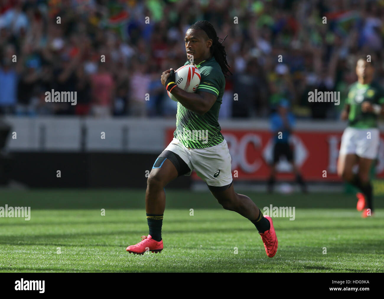 The SA Rugby Springbok Sevens players in action during the 2016 HSBC Sevens tournament at the Cape Town Stadium in Green Point Point, Cape Town. Stock Photo