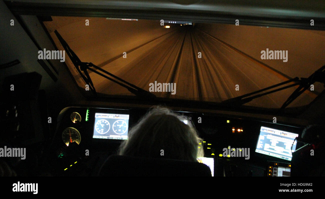 Condcutor Urs Berner sits in the driver's cabin of the first regular passenger train passing the Gotthard Base Tunnel in Switzerland, 11 December 2016. After 17 years of construction, the first regular passenger train will pass the Gotthard Base Tunnel on 11 December 2016. Photo: Aleksandra Bakmaz/dpa Stock Photo