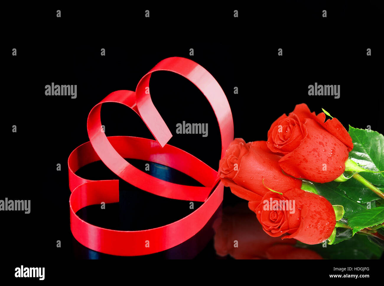 St. Valentine Day. Intertwining of two hearts, on black background with ...