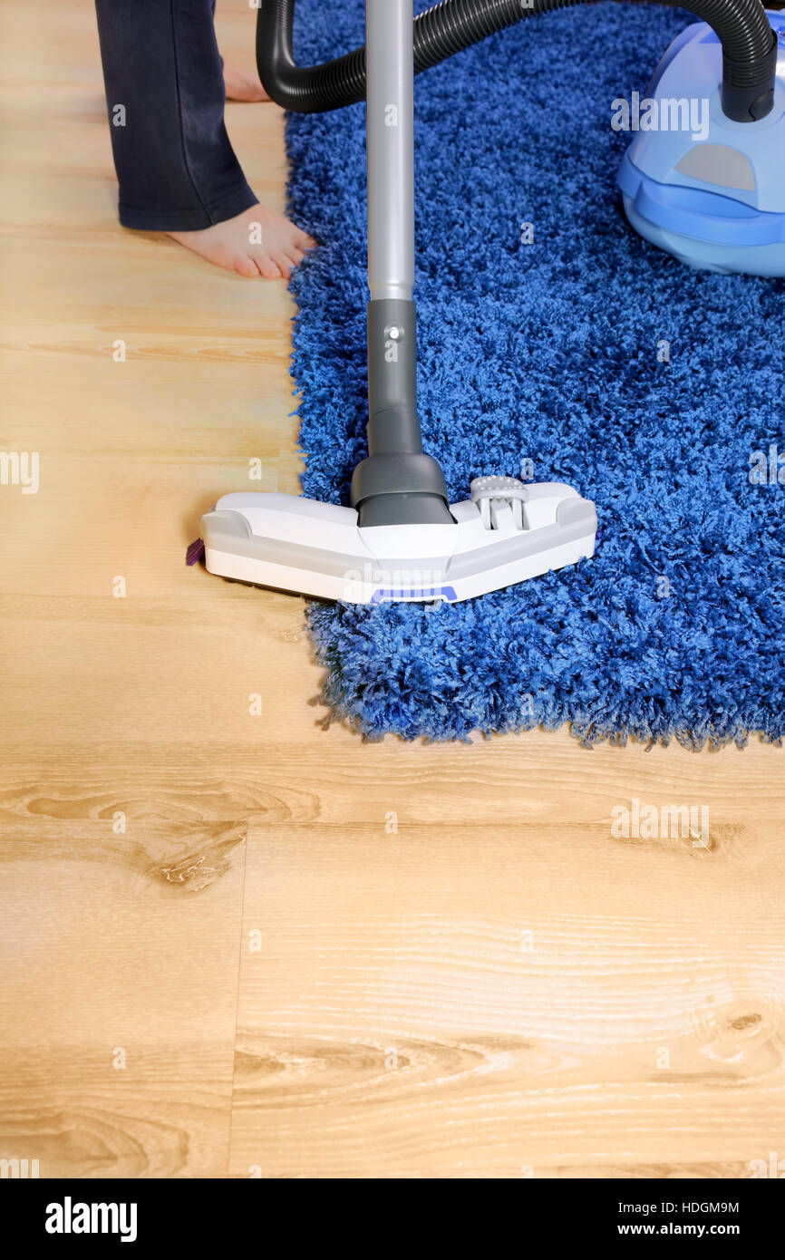 The Metal Pipe Of Vacuum Cleaner In Action Clean A Carpet And Stock The Metal Pipe Of Vacuum Cleaner In Action Clean A Carpet And Laminated Flooring Board