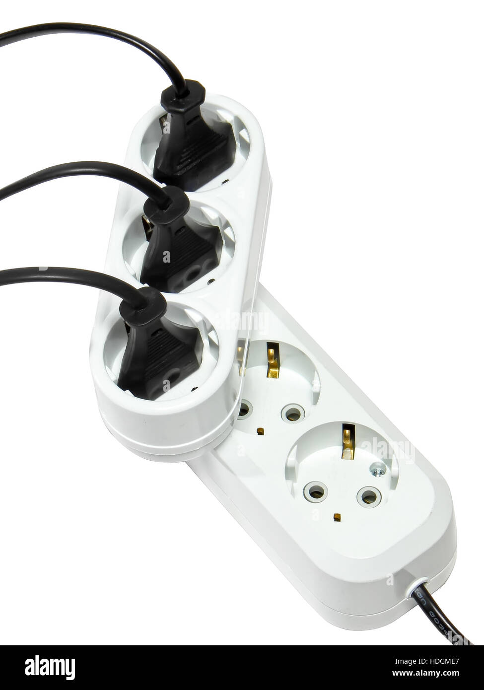 Plugs in electric socket. Isolated over white Stock Photo Alamy