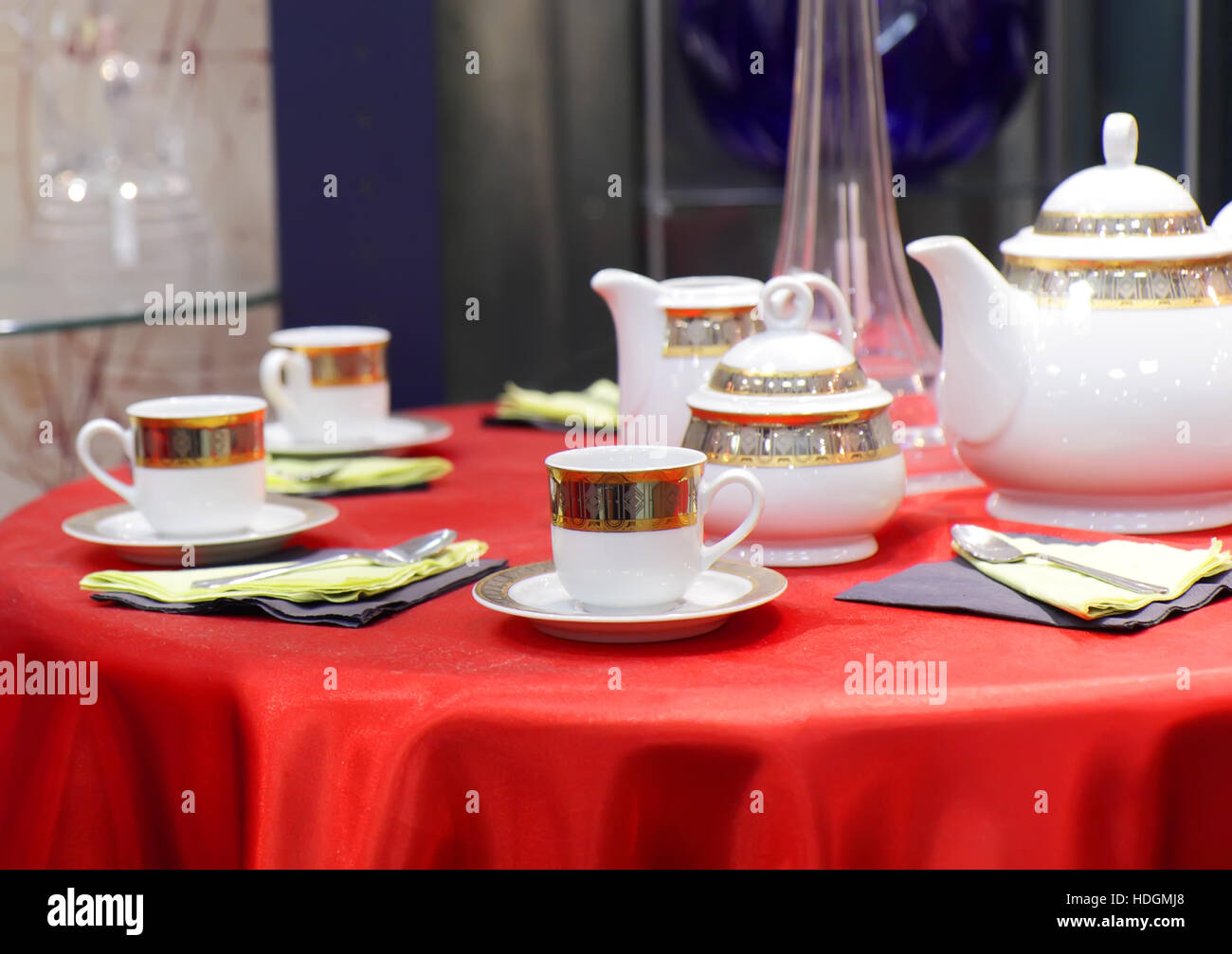 Table appointments on red tablecloth.Accent focus on front Stock Photo