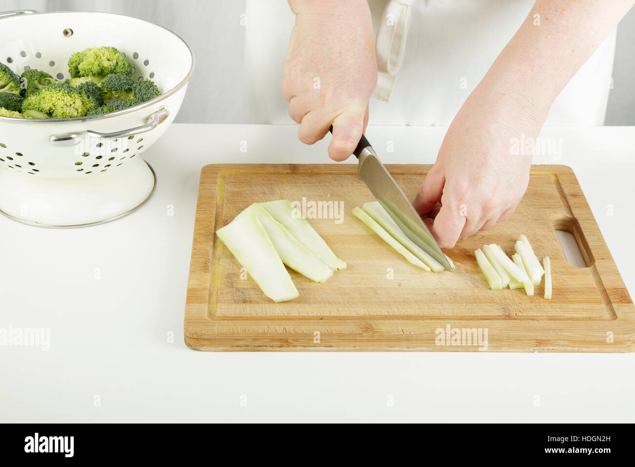 broccoli and stalk - preparing the broccoli stalk for cooking Stock Photo