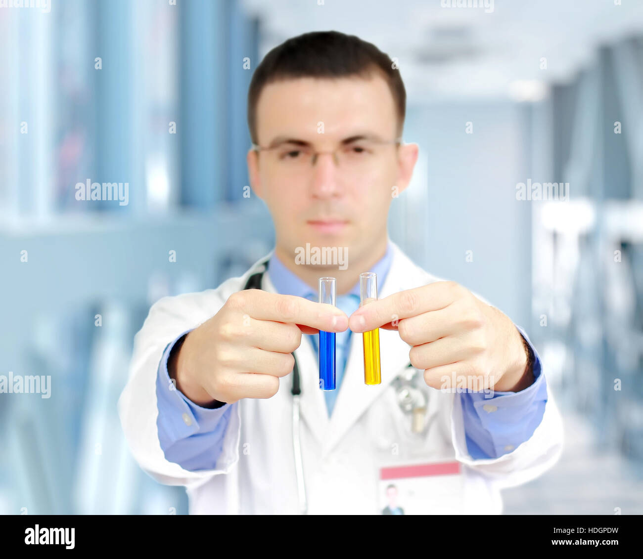 Doctor resarch a medical test glass with urine in Hospital Stock Photo