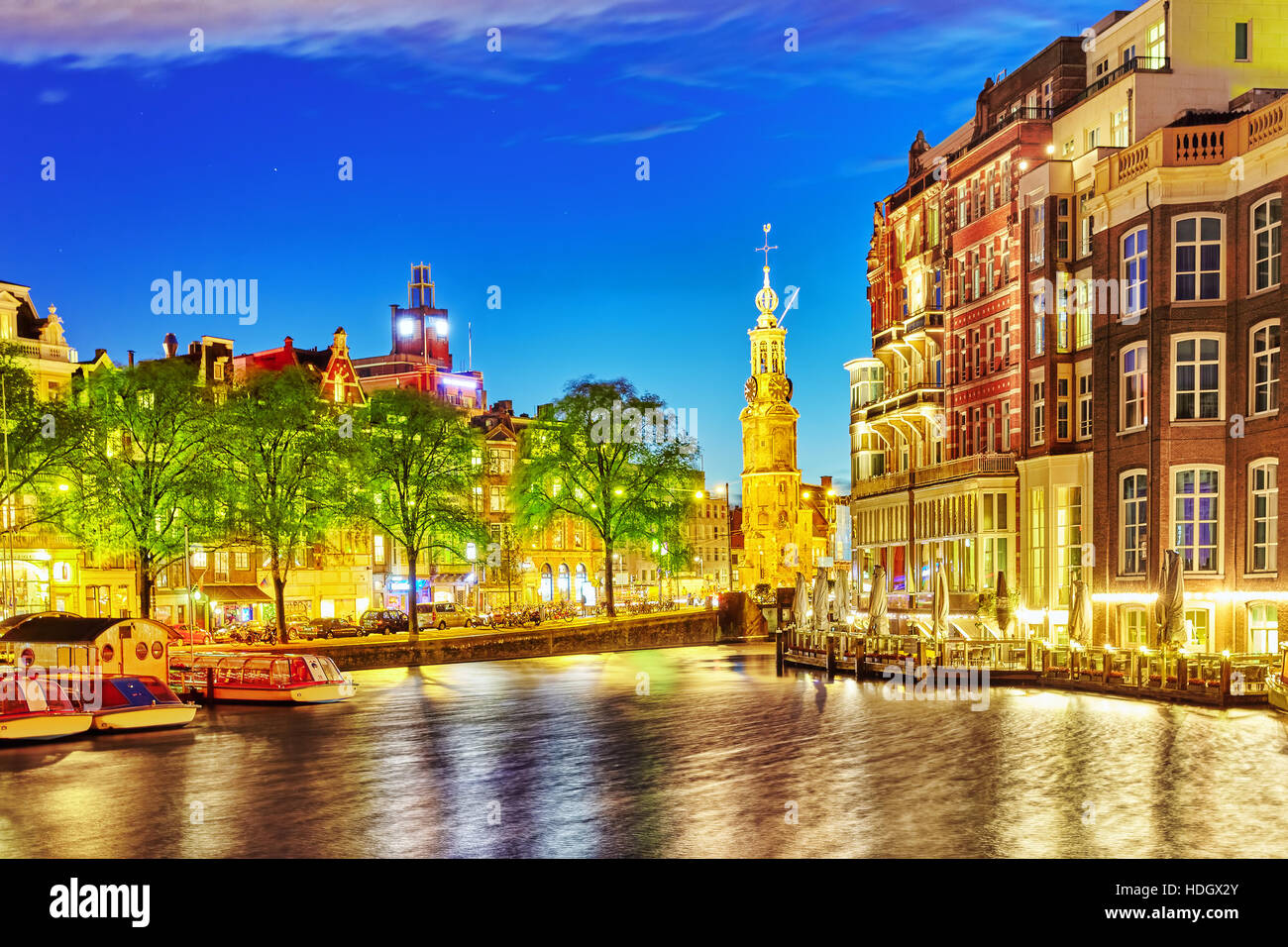 Famous Amstel river and night view of beautiful Amsterdam city. Netherlands Stock Photo