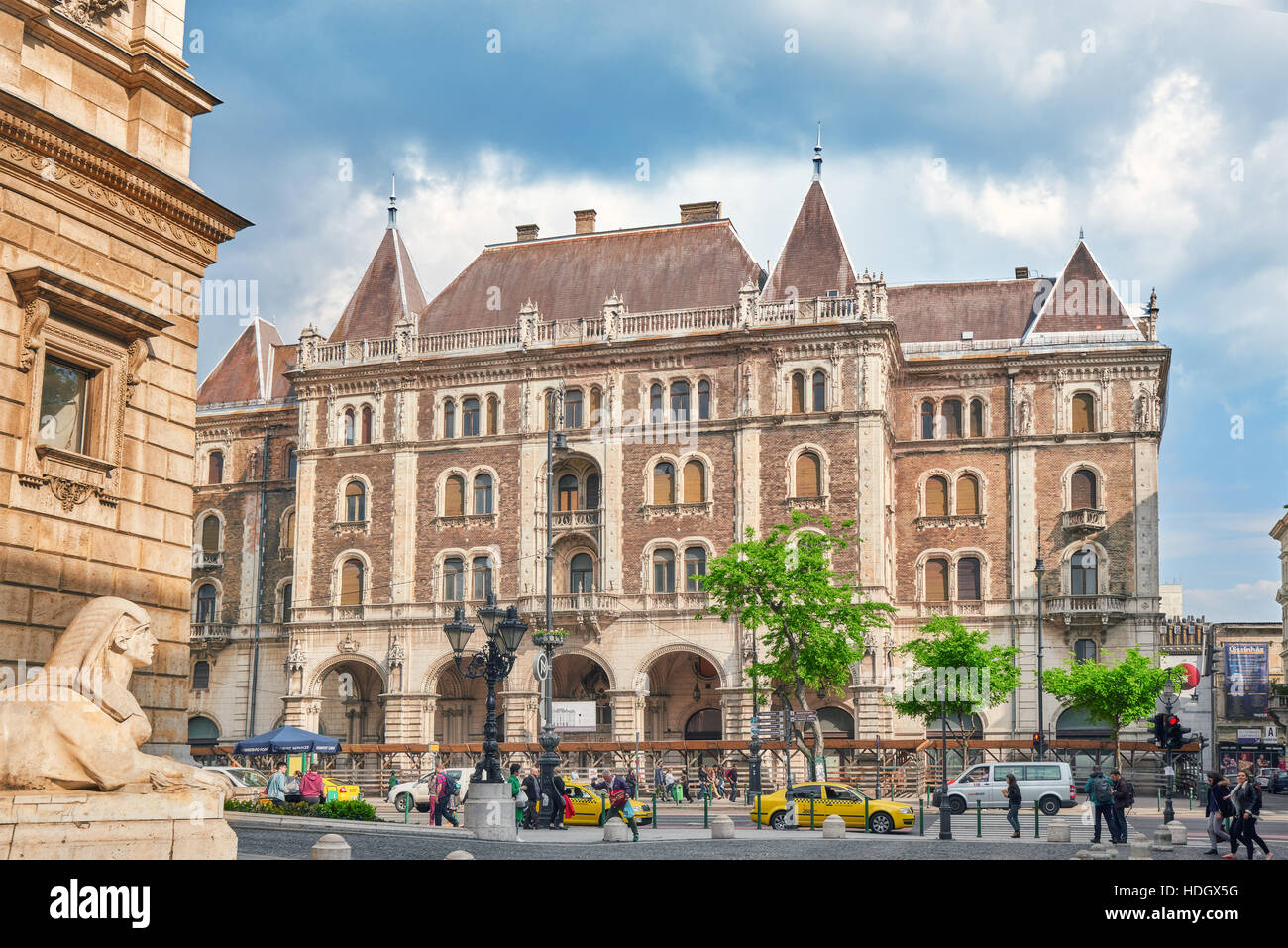BUDAPEST, HUNGARY-MAY 02,2016: Dreschler Palace-gorgeous building in front of the Opera in Budapest. Street view with people. Stock Photo