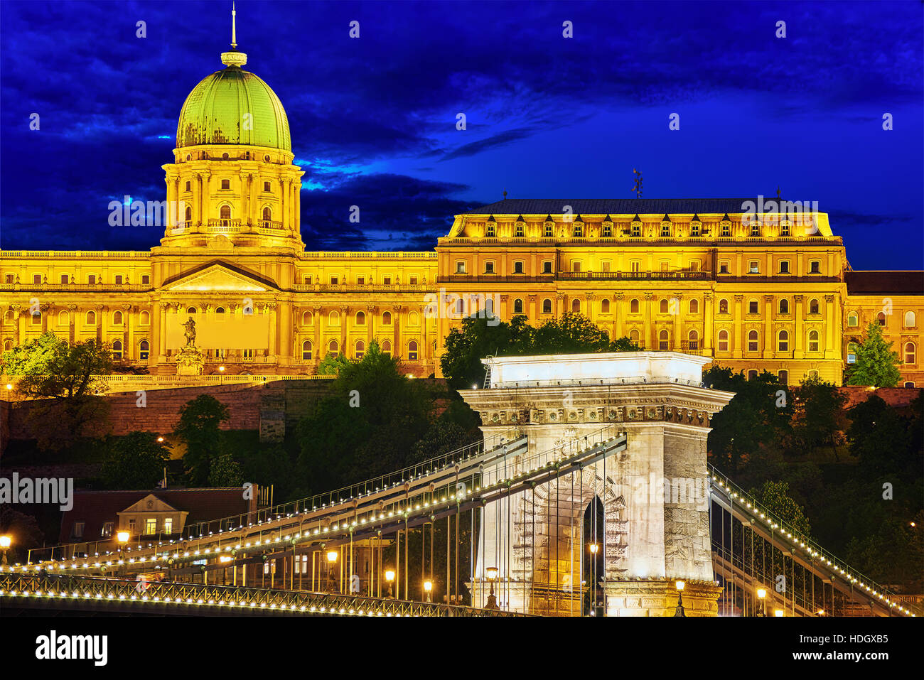 Budapest Royal Castle and Szechenyi Chain Bridge at dusk time from Danube river, Hungary. Stock Photo