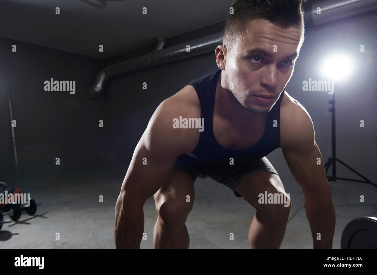 Athlete man about to lift heavy weights Stock Photo