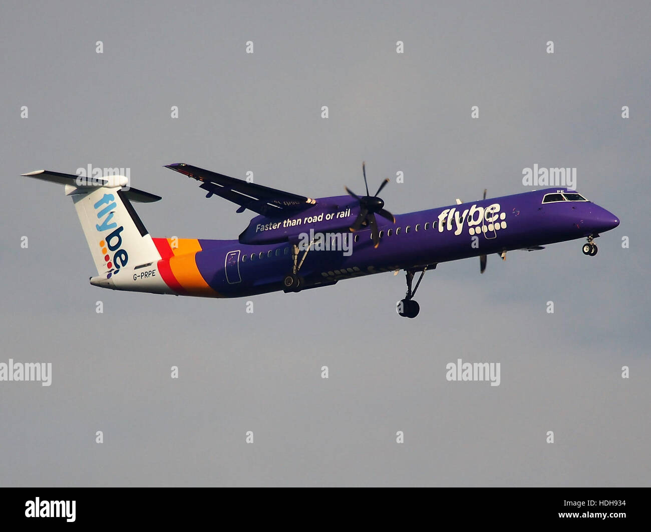 G-PRPE, a Boeing 737 aircraft, is captured on its final approach to Schiphol Airport's runway 18R. The aircraft, operated by a UK-based airline, is seen during its landing sequence, offering a clear view of its descent and preparation for touchdown. Stock Photo