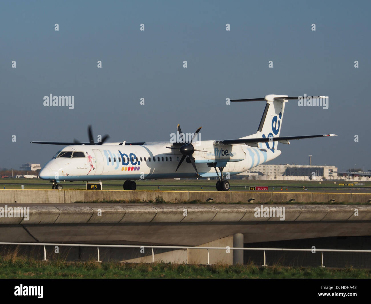 G-JECL Flybe De Havilland Canada DHC-8-402Q Dash 8 - cn 4114 at Schiphol taxiing towards runway 36L pic2 Stock Photo