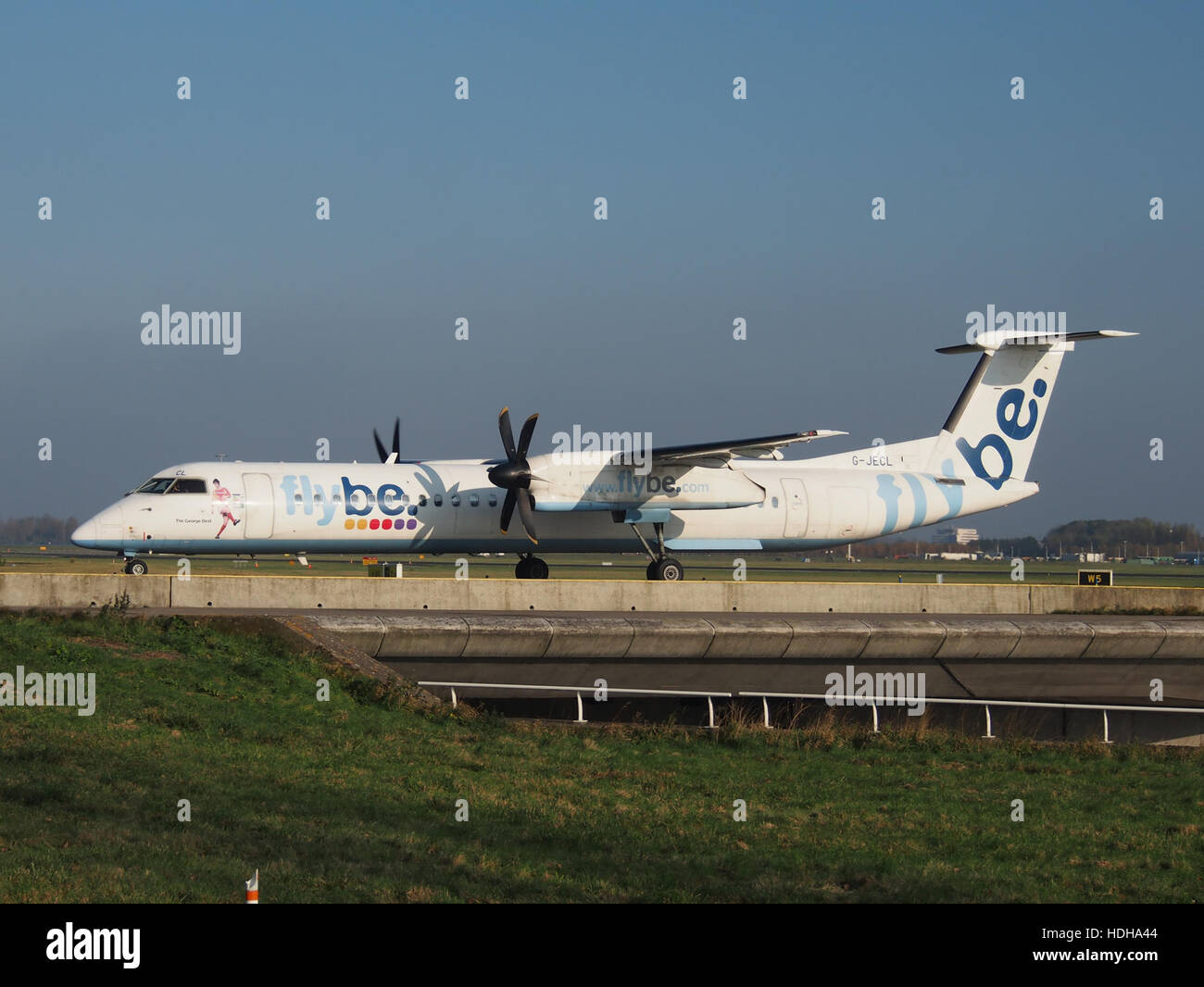 G-JECL Flybe De Havilland Canada DHC-8-402Q Dash 8 - cn 4114 at Schiphol taxiing towards runway 36L pic3 Stock Photo