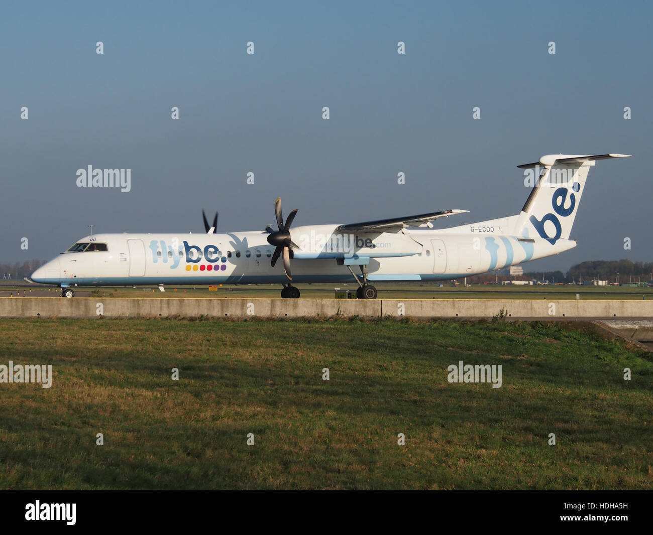 G-ECOO - Bombardier Dash 8 Q400 at Schiphol taxiing towards runway 36L pic2 Stock Photo