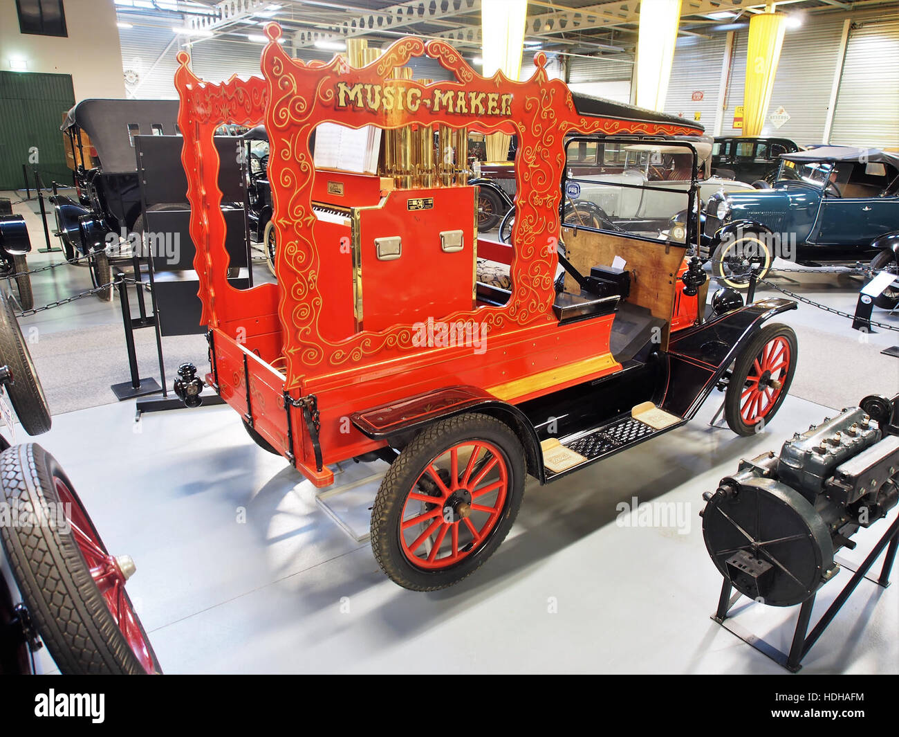 A photograph of a 1916 Ford Model T car equipped with a Calliaphone organ, a unique historical combination of early automobile and music technology. The image showcases the vintage car with the musical instrument. Stock Photo
