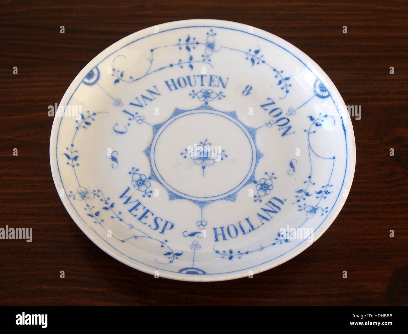 *CJ van Houten Schoteltje* is a piece of collectible porcelain, likely produced by the renowned Dutch ceramic manufacturer CJ van Houten. Known for their high-quality craftsmanship, van Houten pieces are sought after by collectors of fine porcelain and antique ceramics. Stock Photo