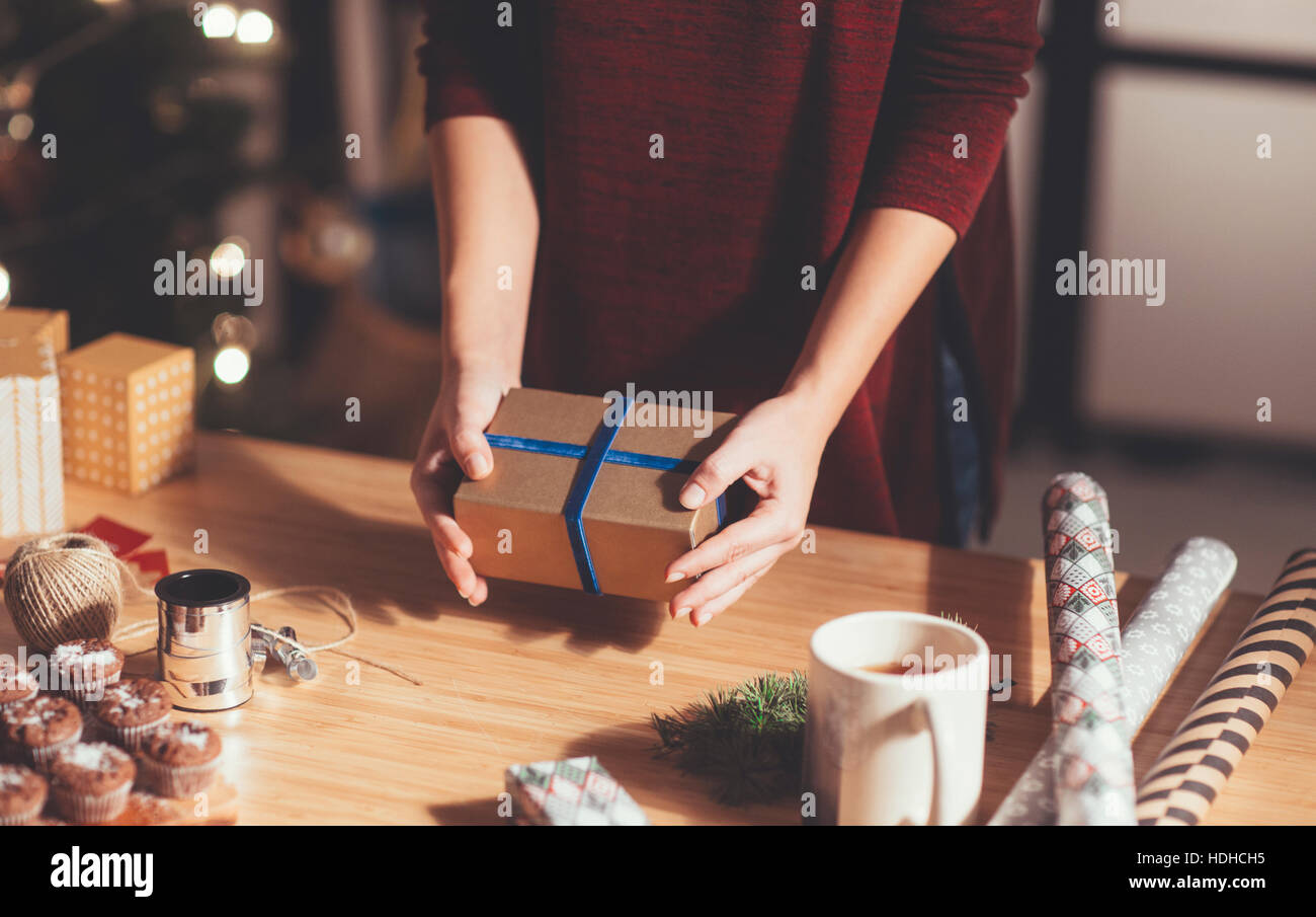 Woman holding beautifully wrapped Christmas present Stock Photo - Alamy