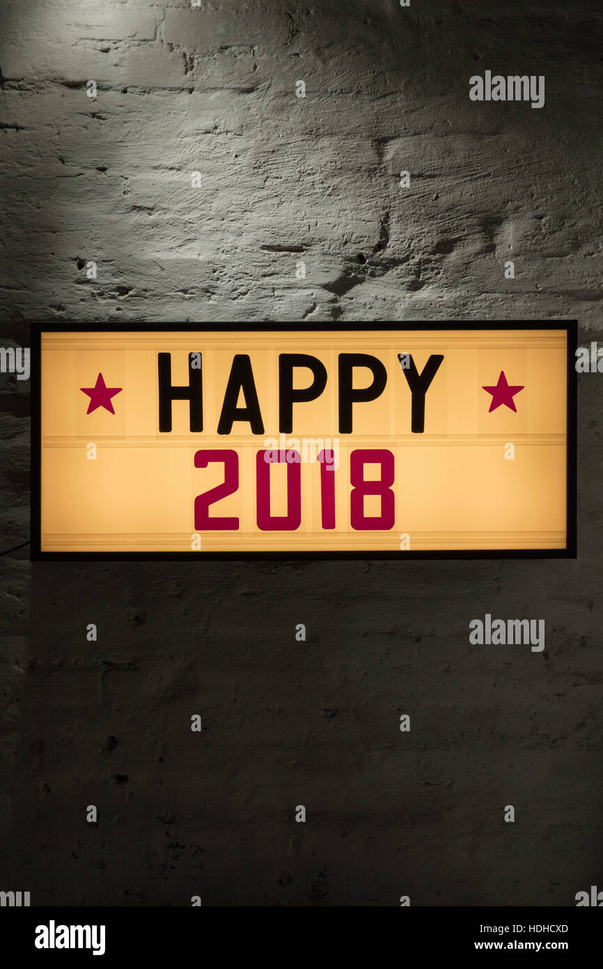 Close-up of Happy 2018 signboard against gray wall Stock Photo