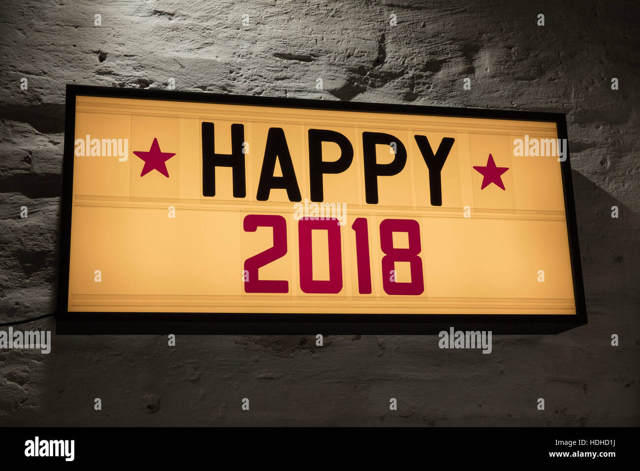 Close-up of Happy 2018 signboard against gray wall Stock Photo
