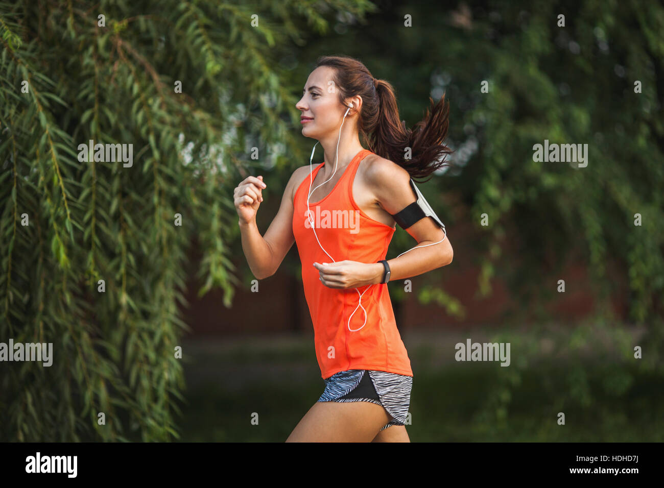 Side view of woman jogging at park Stock Photo